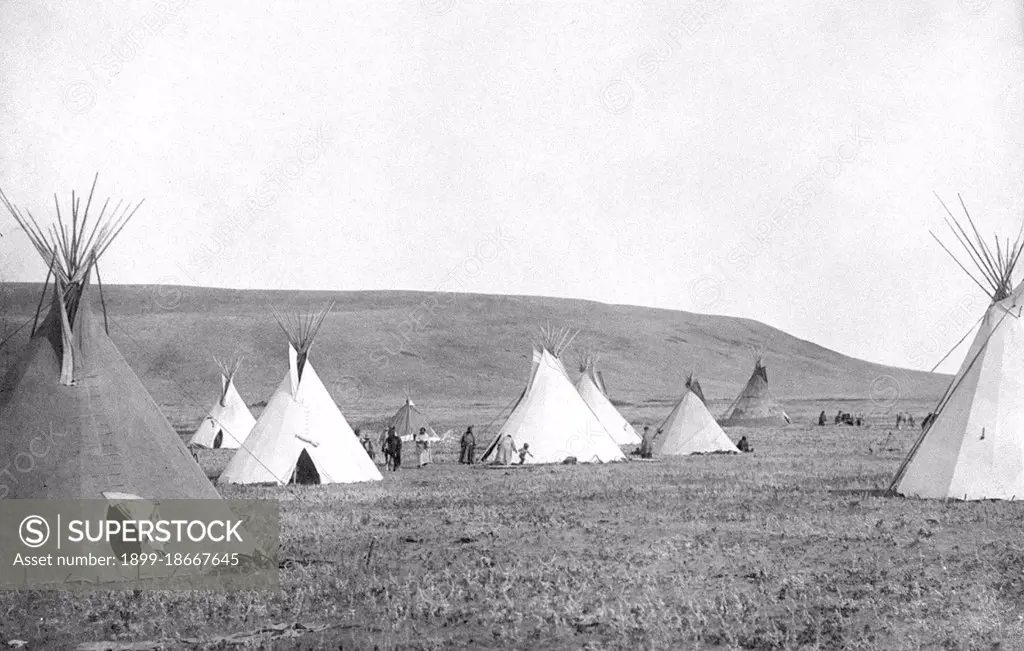 Edward S. Curtis Native American Indians - Atsina camp scene tipis on the plains circa 1908.