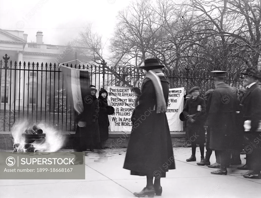 Woman Suffrage Movement - Bonfire on the sidewalk in front of the White House circa 1918 .