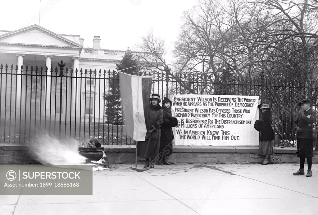 Woman Suffrage Movement - Bonfire on the sidewalk in front of the White House circa 1918 .