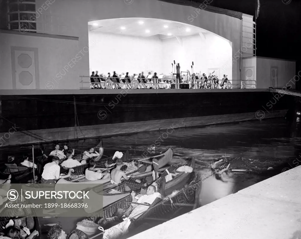 People in canoes listening to the National Symphony Orchestra circa 1938 .