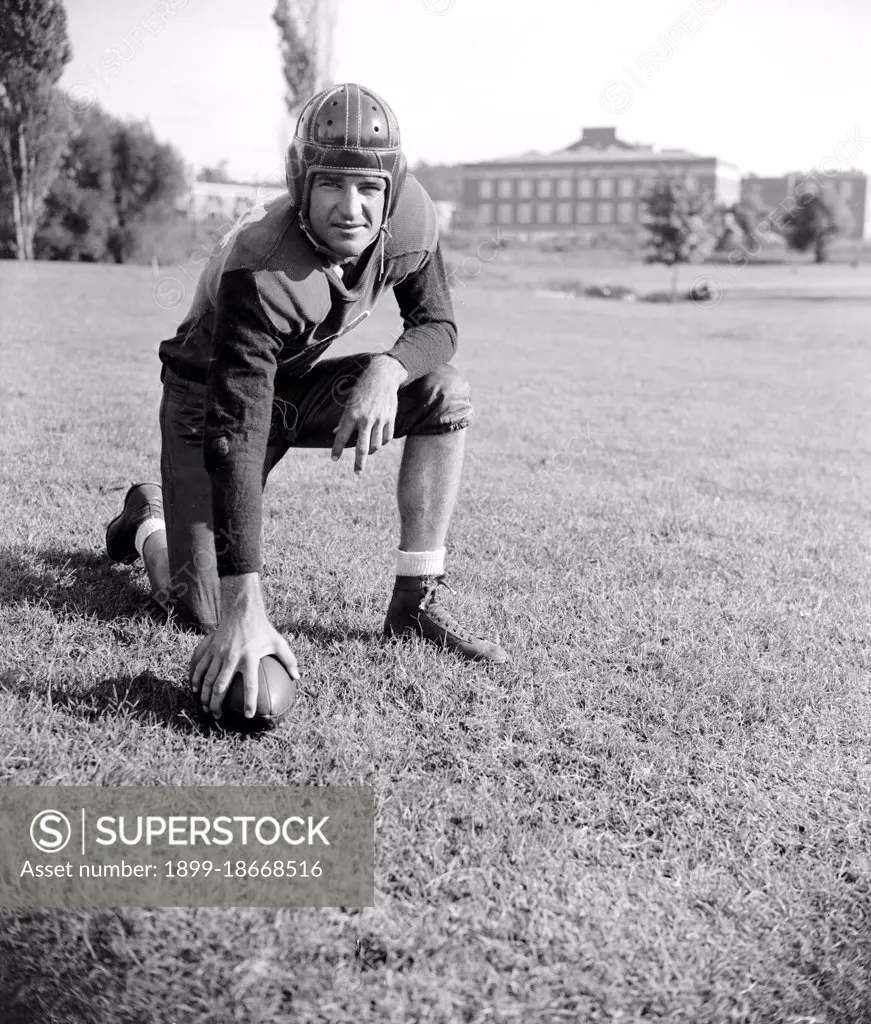 Slinging Sammy' Baugh, new addition to the Washington Redskins, poses for reporters circa September 1937.