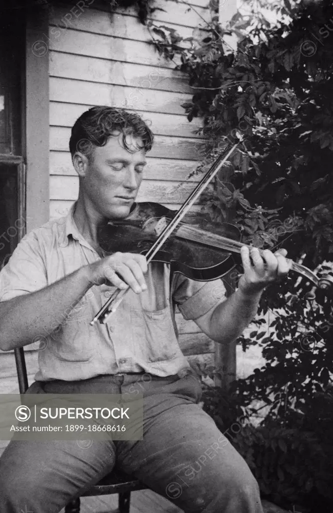 Wayne Perry playing fiddle, Crowley, Louisiana circa 1934-1950.