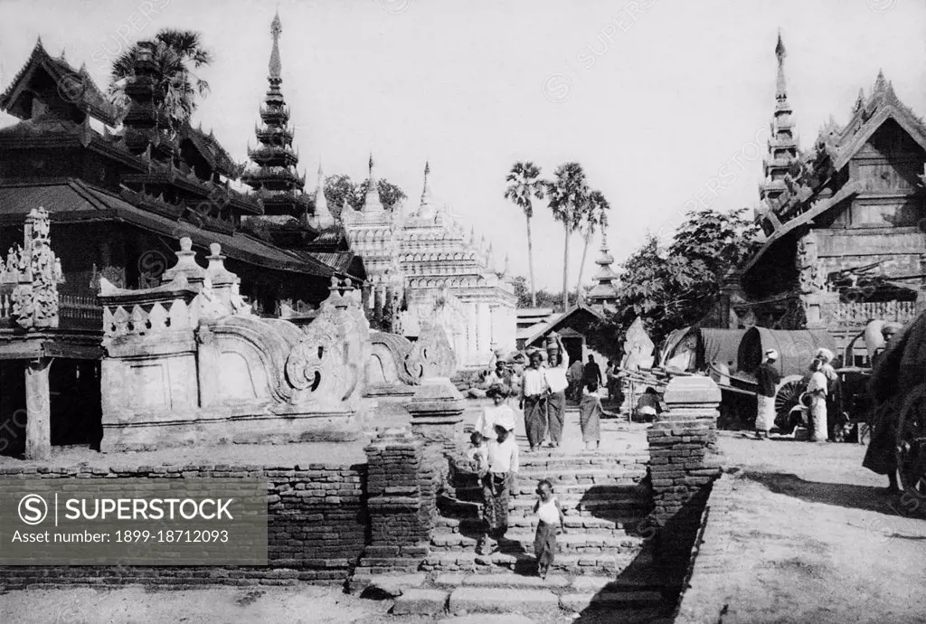 Perhaps the highest revered temple in Bagan, the Ananda Pagoda was built in 1105 CE during the reign of King Kyanzittha (1084-1113) of the Bagan Dynasty. It is one of four surviving original temples of Bagan (also called Pagan). The temple layout is in a cruciform with several terraces leading to a small pagoda at the top covered by an umbrella (hti’). The Buddhist temple houses four standing Buddhas—facing east, north, west and south. The temple is said to be an architectural wonder in a fusion of Mon and adopted Indian styles of architecture.  It was damaged in the earthquake of 1975. However, it has been fully restored and is well maintained by frequent painting and whitewashing of the walls. On the occasion of 900th anniversary of its construction celebrated in 1990 the temple spires were gilded.