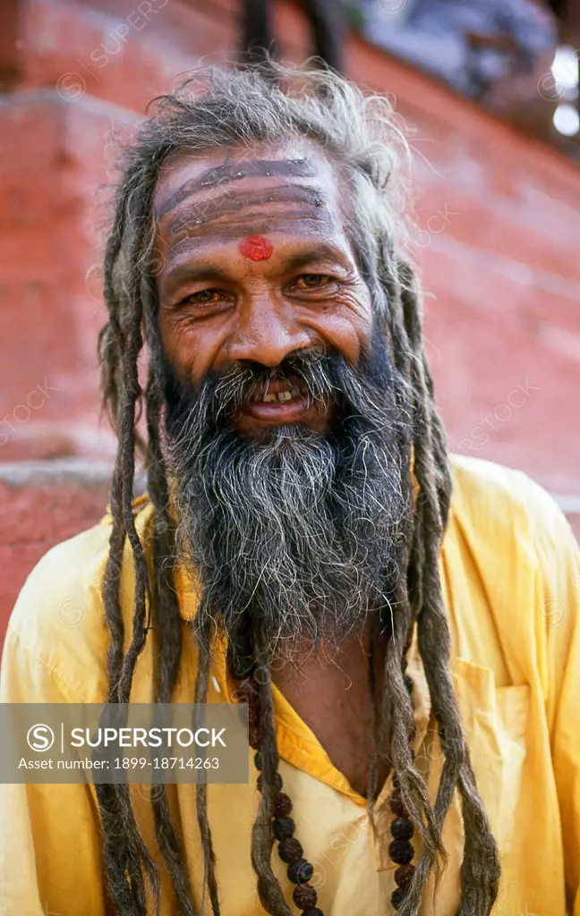 They are known, variously, as sadhus (saints, or 'good ones'), yogis (ascetic practitioners), fakirs (ascetic seeker after the Truth) and sannyasins (wandering mendicants and ascetics). They are the ascetic - and often eccentric - practitioners of an austere form of Hinduism. Sworn to cast off earthly desires, some choose to live as anchorites in the wilderness. Others are of a less retiring disposition, especially in the towns and temples of Nepal's Kathmandu Valley. If the Vale of Kathmandu seems to boast more than its share of sadhus and yogis, this is because of the number and importance of Hindu temples in the region. The most important temple of Vishnu in the valley is Changunarayan, and here the visitor will find many Vaishnavite ascetics. Likewise, the most important temple for followers of Shiva is the temple at Pashupatinath. Vishnu, also known as Narayan, can be identified by his four arms holding a sanka (sea shell), a chakra (round weapon), a gada (stick-like weapon) and a