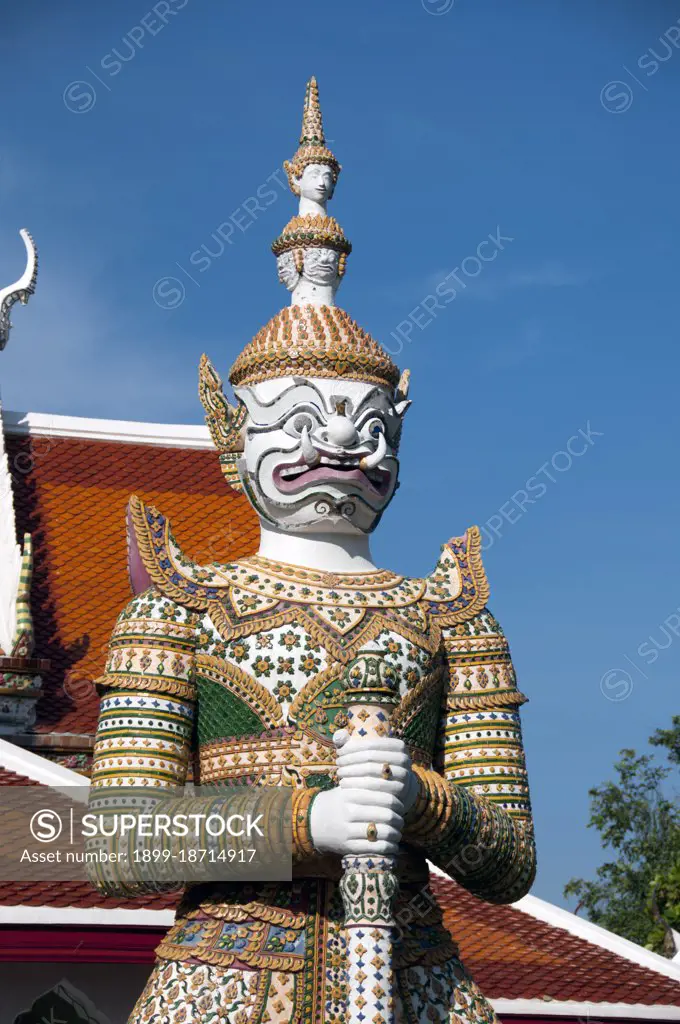 In Buddhist mythology, the Yaka (Yaksha or Yak) are the attendants of Vaisravaa, the Guardian of the Northern Quarter, a beneficent god who protects the righteous. The term also refers to the Twelve Heavenly Generals who guard Bhaiajyaguru, the Medicine Buddha. Wat Arun Rajwararam (Temple of the Dawn), full name Wat Arunratchawararam Ratchaworamahawihan, is a Thai Buddhist temple on the Thonburi west bank side of the Chao Phraya River in Bangkok. It is named after Aruna, the Indian God of Dawn. A monastery has stood here since the Ayutthayan period (1351 - 1767), but the temple's outstanding feature, the Khmer-style central prang, was not begun until 1809, during the reign of King Buddha Loetla Nabhalai (Rama II).