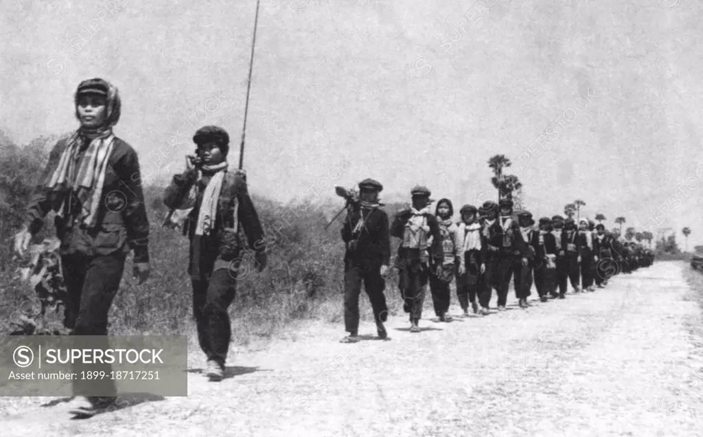 A Khmer Rouge women's batallion on the march, c.1974-1975. This image was used on the Khmer Rouge currency notes printed in China in 1975 but never issued.