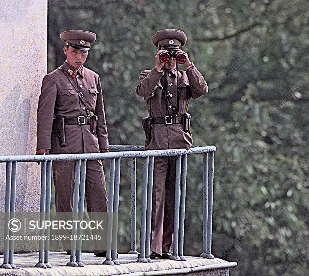 North Korean soldiers watch a repatriation ceremony from a tower on the North Korean side Military Demarkation Line (MDL). 