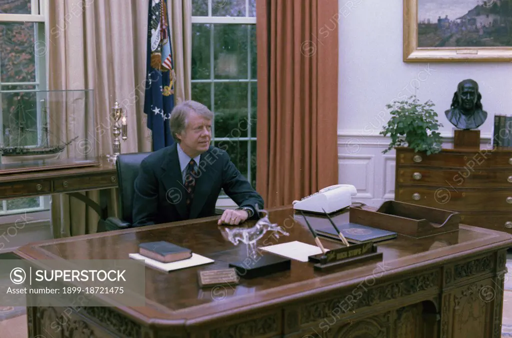 Jimmy Carter at his desk in the Oval Office circa  23 November 1977.