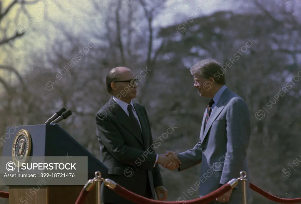 Jimmy Carter and Menachem Begin shake hands during a welcoming ceremony for the Prime Minister of Israel. circa  03/21/1978.