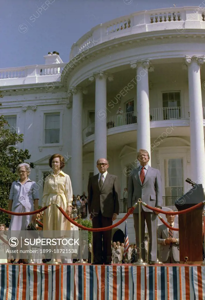 Jimmy Carter and Rosalynn Carter welcome Menachem Begin and Mrs. Begin during an arrival ceremony for a state visit of the Prime Minister of Israel. circa  19 July 1977.