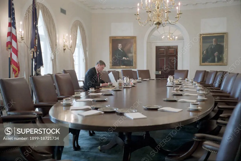 President Reagan working in the White House Cabinet Room.