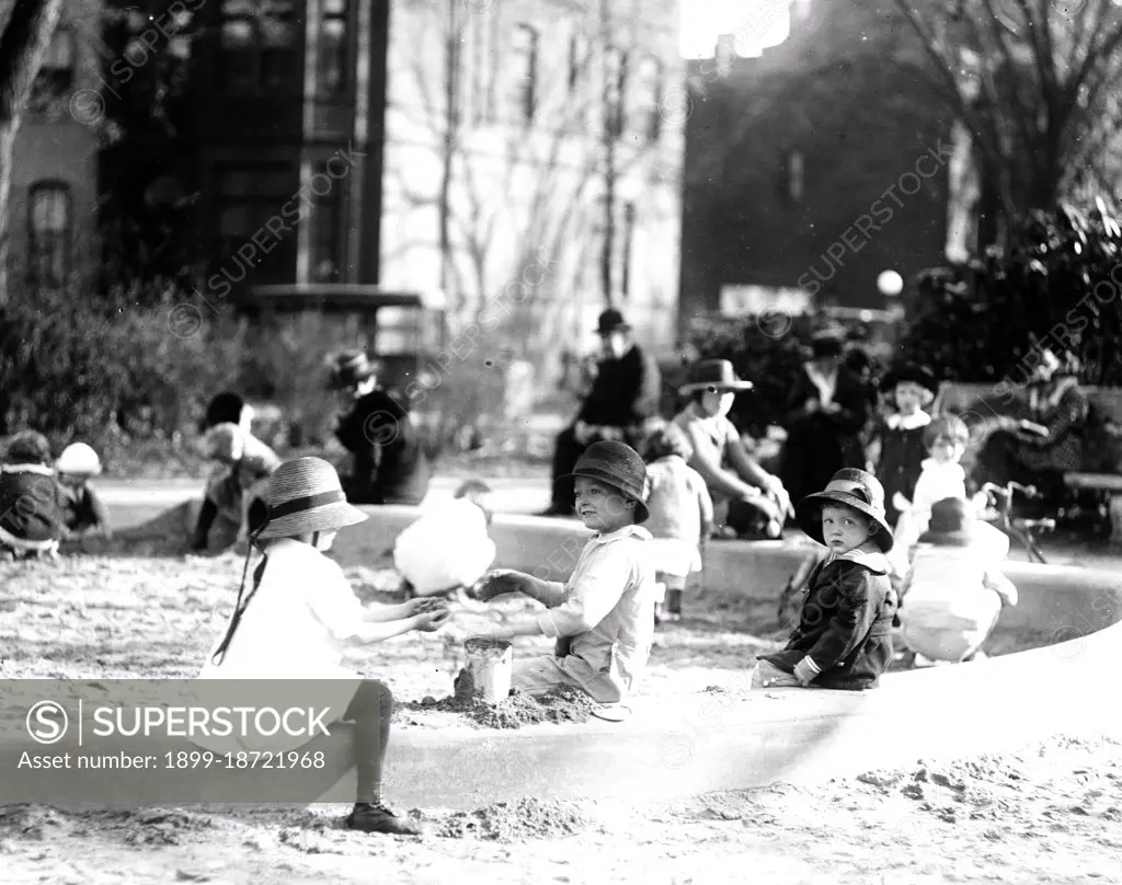 Children playing outside circa 1919-1921 (early 1900s). 