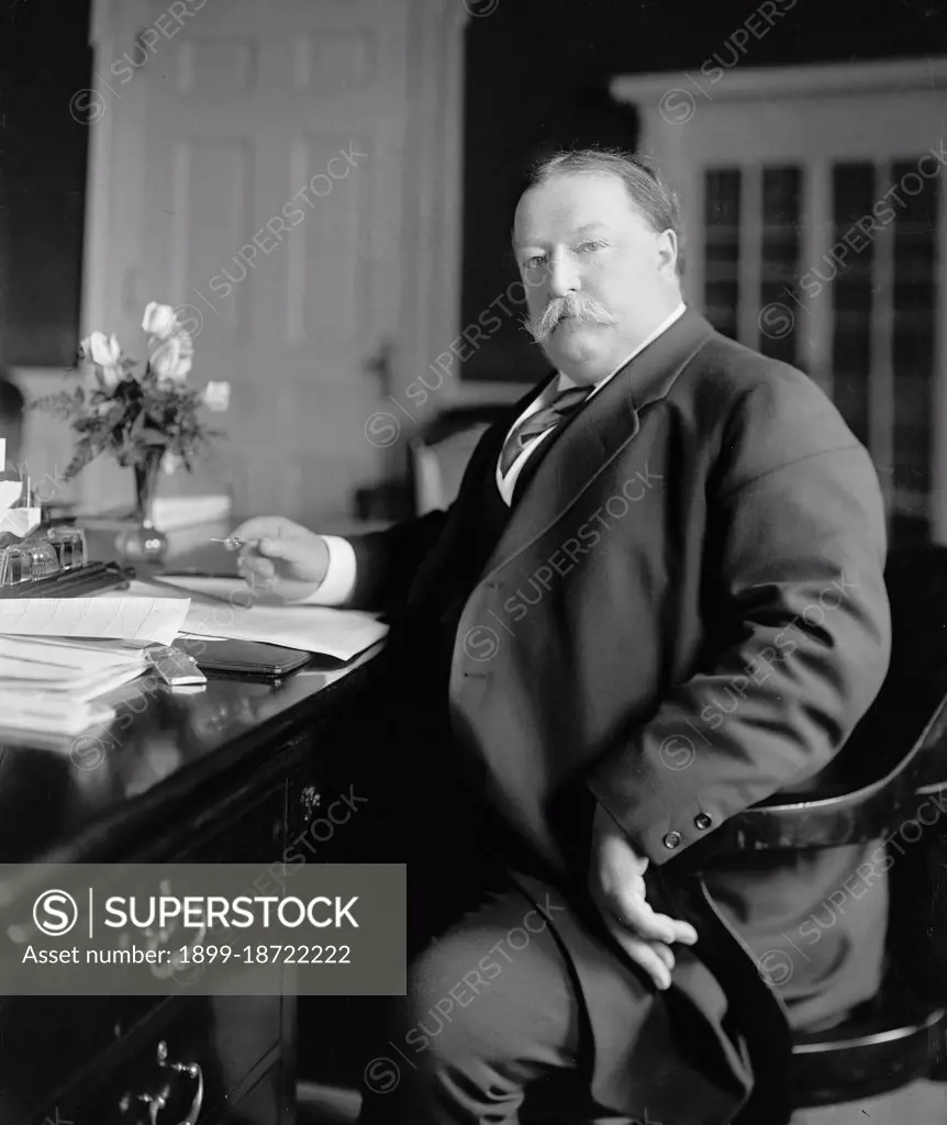 President William Howard Taft sitting at his desk circa 1909-1913.