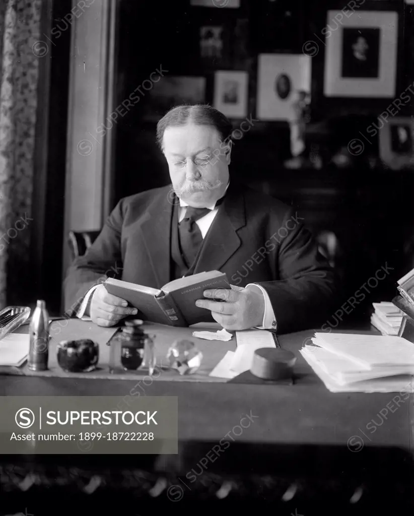 Secretary of War William Howard Taft sitting at his desk circa 1904-1908.