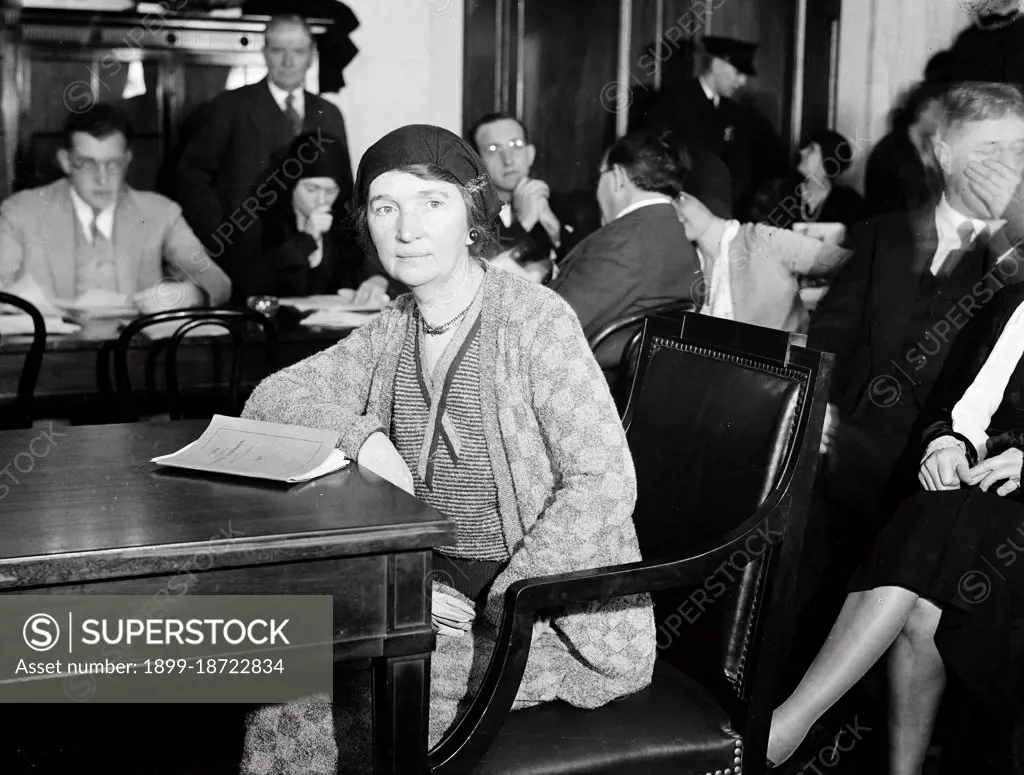 Margaret Sanger, proponent of the eugenics movement, sitting at a conference table circa 1931.