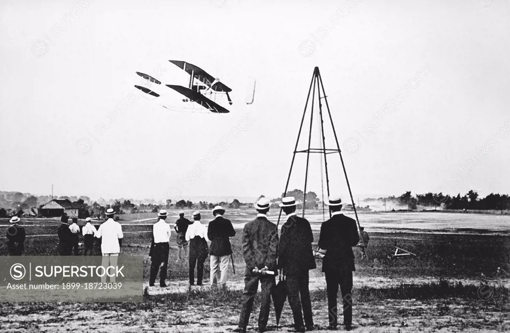 1909 - The Wright Brothers test fly their aircraft on Fort Myer's parade field. 