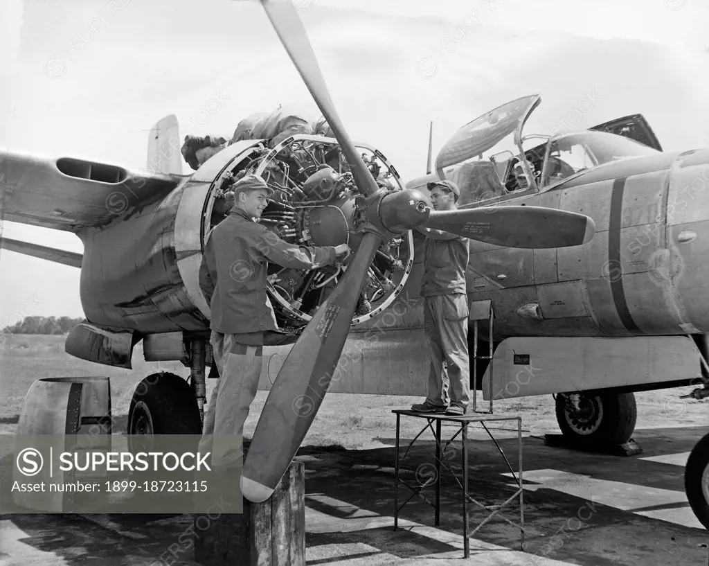 Airman works on a B-26 aircraft at the first North Dakota Air National Guard organizational 'summer camp' at Hector Field, Fargo, N.D., June 1948.