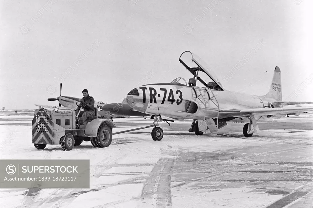 A T-33 aircraft is towed on the flight line at the North Dakota Air National Guard circa 1954.