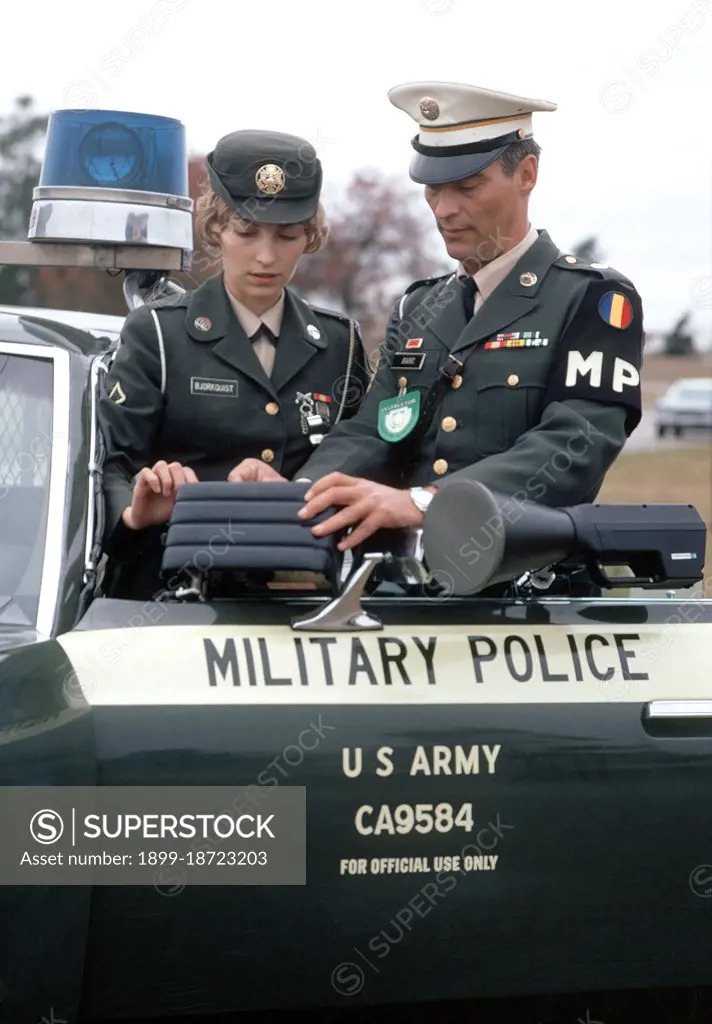 1973 - A U.S. Army Miltiary Police School instructor shows a policewoman how to use radar speed detection equipment. 