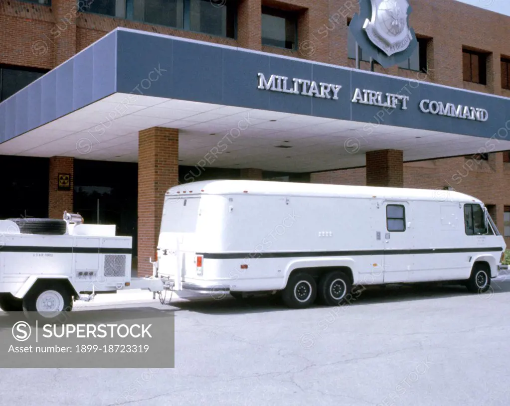 1981 - A view of the 15,000-pound Personnel Support for Contingency Operations (PERSCO) van with a 5,000-pound generator-carrying trailer in tow while parked at the entrance to the Military airlift Command (MAC) building.