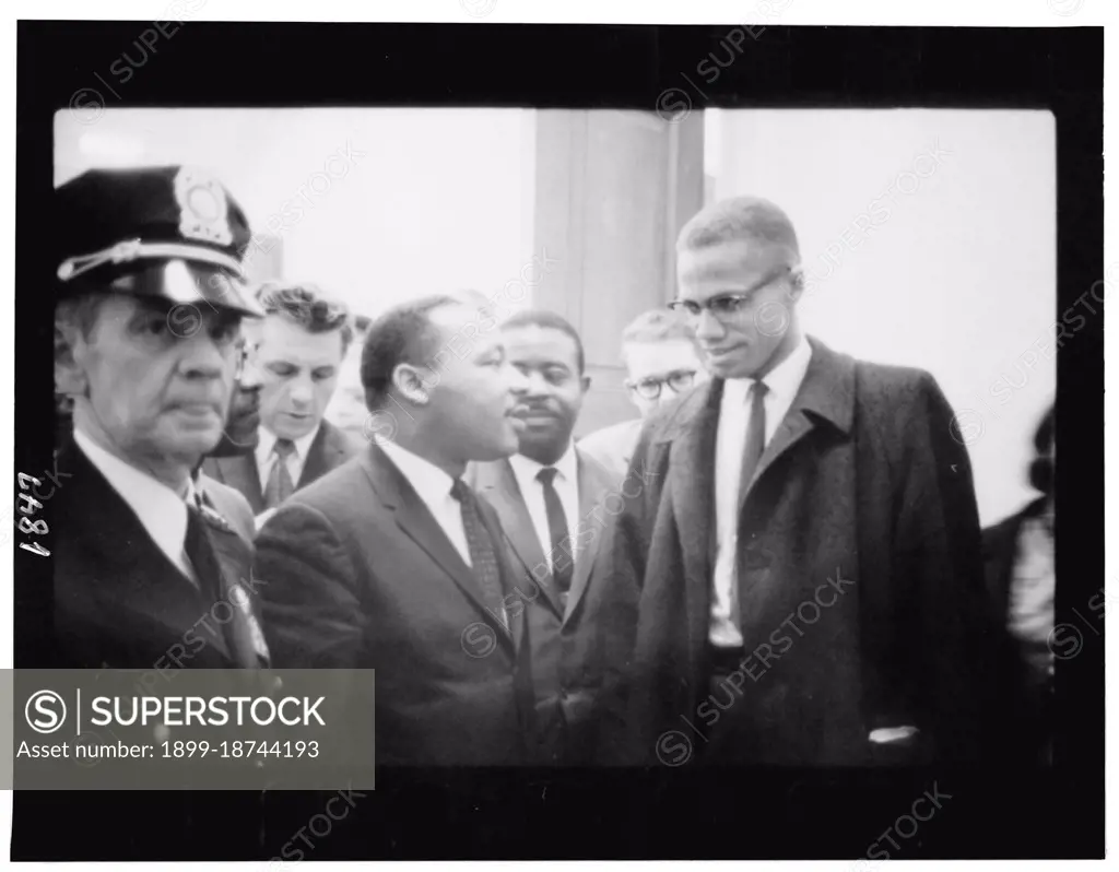 March 26, 1964 - Martin Luther King and Malcolm X waiting for press conference