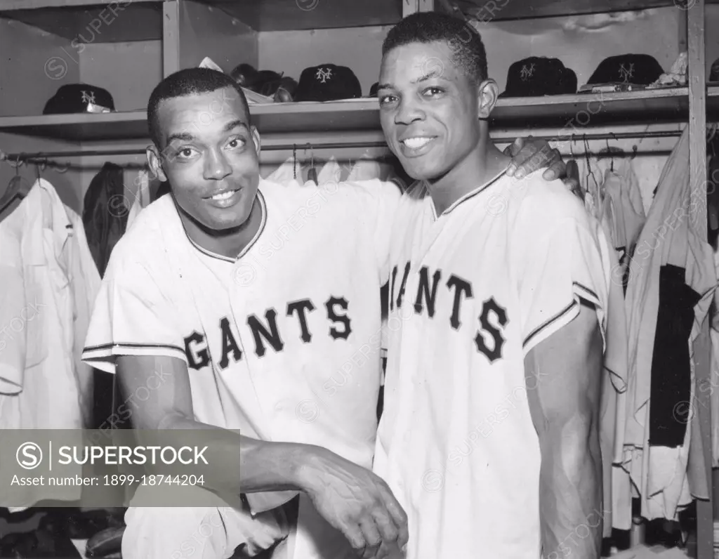 Monte Irvin (left) and Willie Mays, posing in the Giants' dressing room, led the Giants to a dramatic victory over the Milwaukee Braves. New York, NY, 6/22/54. 