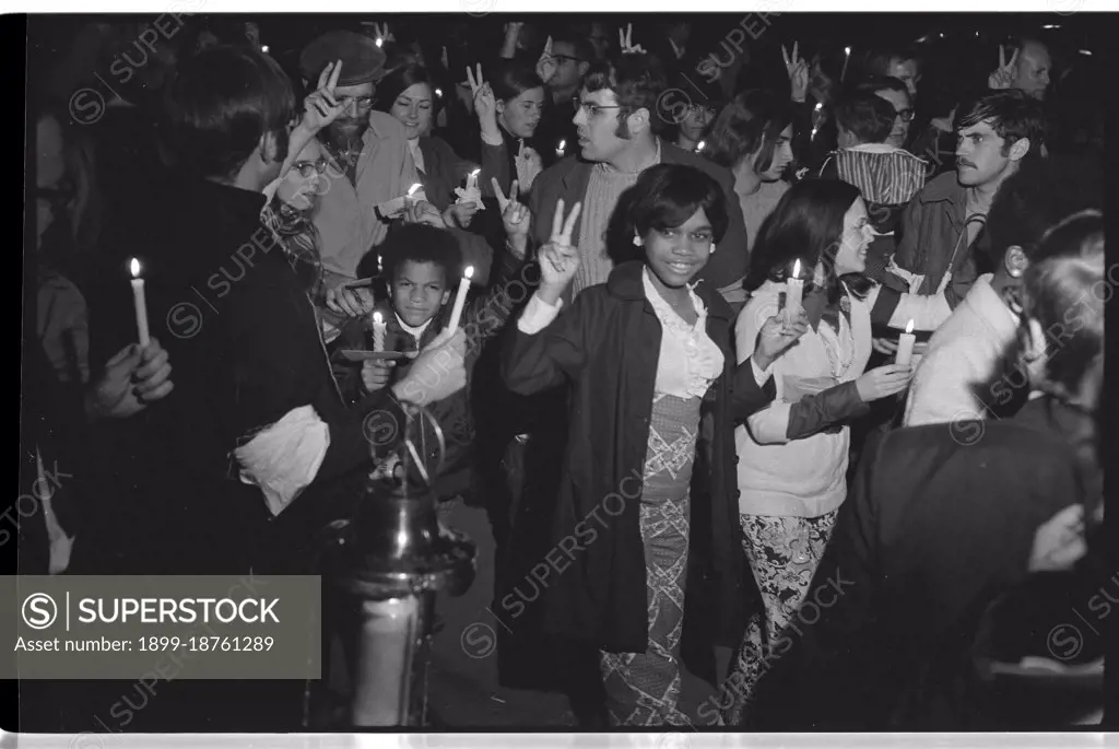 Crowd of people flashing Peace signs and holding candles, including African Americans, at a march at night to the White House, led by Coretta Scott King as part of the Moratorium to End the War in Vietnam, Washington, DC, October 15, 1969. Photo by Warren K Leffler/US News and World Report Magazine Collection/GG Vintage Images)