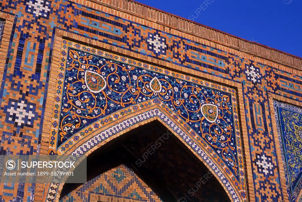 The Registan contains three madrasahs (schools), the Ulugh Beg Madrasah (1417-1420), Tilya-Kori Madrasah (1646-1660) and the Sher-Dor Madrasah (1619-1636). The Tilya-Kori Madrasah was built in the mid-17th century by the Shaybanid Amir Yalangtush. The name Tilya-Kori means gilded or gold-covered, and the entire building is lavishly decorated with elaborate geometrical arabesques and sura from the Quran both outside and especially within. A magnificent turquoise dome rises over the left (western) side of the building, decorated inside with gilded Quranic inscriptions and delicate muqarnas hanging stalactite decorations. The interior of the madrasah comprises rooms for students with accompanying vestibules surrounding three-sides of a square courtyard, while a domed mosque occupies the fourth. The dome rises in four stages. A rectangular plinth forms the primary prayer hall and rises above the madrasa walls. Next, two terraced octagonal tiers rise to support a high cylindrical drum. The 