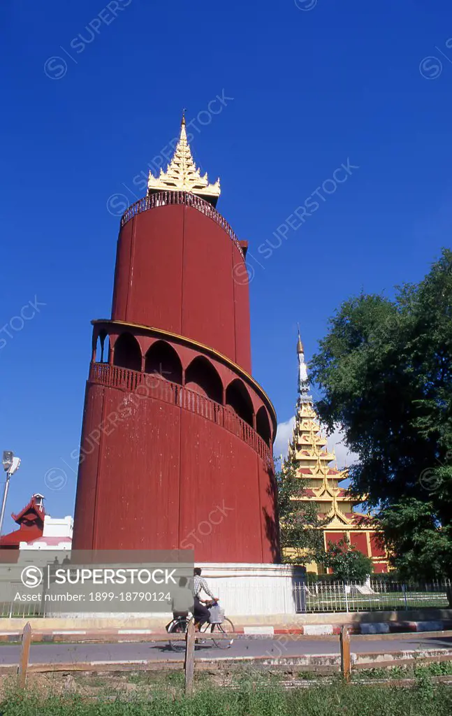 Mandalay Fort's almost 3km (2 miles) of walls enclose King Mindon's palace. The walls rise 8m (26ft). The palace was constructed, between 1857 and 1859 as part of King Mindon's founding of the new royal capital city of Mandalay. The plan of Mandalay Palace largely follows the traditional Burmese palace design, inside a walled fort surrounded by a moat. The palace itself is at the centre of the citadel and faces east. All buildings of the palace are of one storey in height. The number of spires above a building indicated the importance of the area below. Mandalay, a sprawling city of more than 1 million people, was founded in 1857 by King Mindon to coincide with an ancient Buddhist prophecy. It was believed that Gautama Buddha visited the sacred mount of Mandalay Hill with his disciple Ananda, and proclaimed that on the 2,400th anniversary of his death, a metropolis of Buddhist teaching would be founded at the foot of the hill.