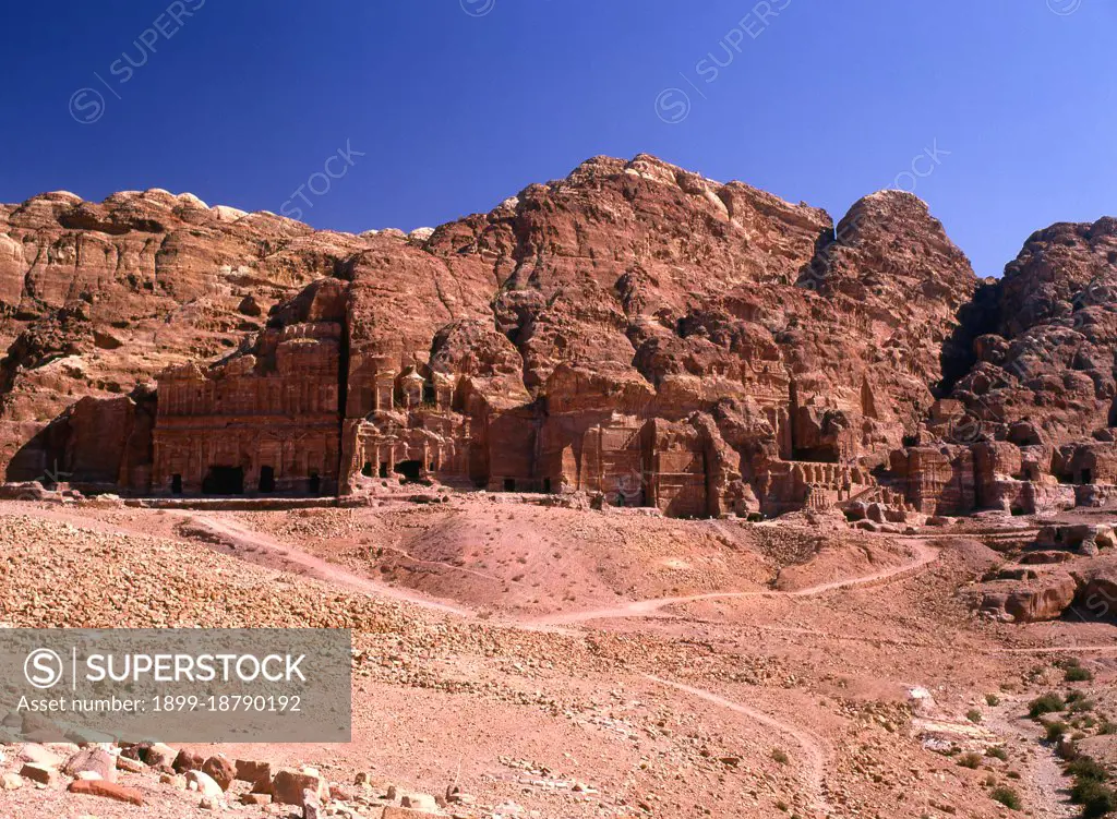 Petra was first established as a city by the Nabataean Arabs in the 4th century BCE, and owed its birth and prosperity to the fact that it was the only place with clear and abundant water between the Hijaz trading centres of Mecca and Medina, and Palestine. Hewn directly into the Nubian sandstone ridges of the south Jordanian desert, it seems probable that - given its excellent defensive position and good water supplies - Petra has been continually occupied from as early as Paleolithic times. It is thought to be mentioned in the Bible as Sela, a mountain fortress captured by Amaziah, King of Judah, in the 9th century BC, when the defenders were hurled to their deaths from the summit, and as many as 10,000 people died. The city's Latin name, Petra - literally, 'Rock' - probably replaced the biblical name Sela at the time of the Roman conquest some 1,900 years ago. Today, in Arabic, the ancient site is still called Batraa, though the valley in which it is situated is known as Wadi Musa -