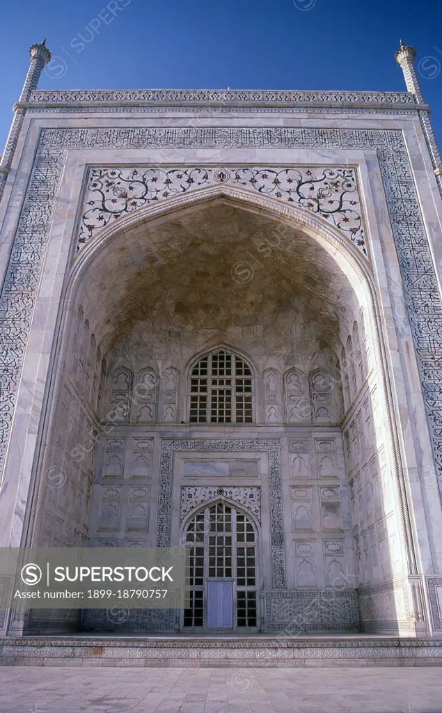 The Taj Mahal was built between 1632 and 1648 by Mughal emperor Shah Jahan (1592 - 1666) in memory of his third wife, Mumtaz Mahal. The Taj Mahal incorporates and expands on design traditions of Persian architecture and earlier Mughal architecture. Specific inspiration came from successful Timurid and Mughal buildings including; the Gur-e Amir (the tomb of Timur, progenitor of the Mughal dynasty, in Samarkand), Humayun's Tomb, Itmad-Ud-Daulah's Tomb (sometimes called the Baby Taj), and Shah Jahan's own Jama Masjid in Delhi. While earlier Mughal buildings were primarily constructed of red sandstone, Shah Jahan promoted the use of white marble inlaid with semi-precious stones, and buildings under his patronage reached new levels of refinement.