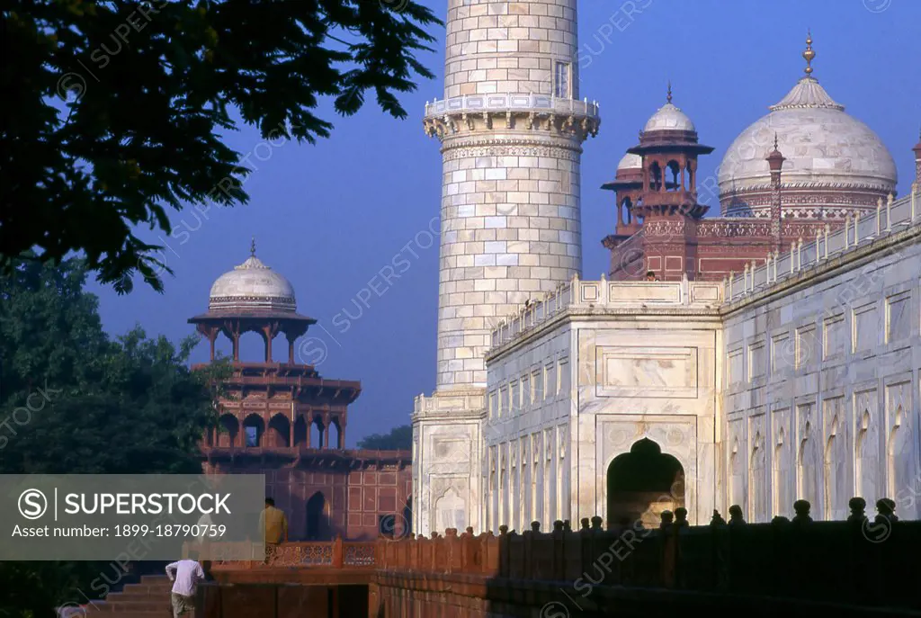 The Taj Mahal was built between 1632 and 1648 by Mughal emperor Shah Jahan (1592 - 1666) in memory of his third wife, Mumtaz Mahal. The Taj Mahal incorporates and expands on design traditions of Persian architecture and earlier Mughal architecture. Specific inspiration came from successful Timurid and Mughal buildings including; the Gur-e Amir (the tomb of Timur, progenitor of the Mughal dynasty, in Samarkand), Humayun's Tomb, Itmad-Ud-Daulah's Tomb (sometimes called the Baby Taj), and Shah Jahan's own Jama Masjid in Delhi. While earlier Mughal buildings were primarily constructed of red sandstone, Shah Jahan promoted the use of white marble inlaid with semi-precious stones, and buildings under his patronage reached new levels of refinement.