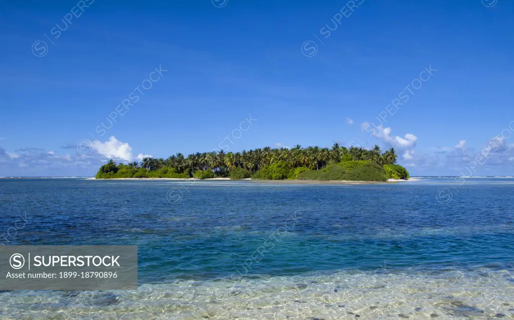 Asia's smallest and least-known nation, the Republic of Maldives, lies scattered from north to south across a 750-kilometre sweep of the Indian Ocean 500 kilometres south-west of Sri Lanka. More than 1000 islands, together with innumerable banks and reefs, are grouped in a chain of nineteen atolls which extends from a point due west of Colombo to just south of the equator. The atolls, formed of great rings of coral based on the submarine Laccadive-Chagos ridge, vary greatly in size. Some are only a few kilometres square, but in the far south the great atoll of Suvadiva is sixty-five kilometres across, and has a central lagoon of more than 2000 square kilometres. The northern and central atolls are separated from each other by comparatively narrow channels of deep water, but in the south Suvadiva is cut off by the eighty-kilometre-wide One-and-a-half-Degree Channel. Addu Atoll is still more isolated, being separated from the atoll of Suvadiva by the seventy-kilometre-wide Equatorial Cha