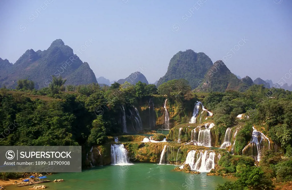 Ban Gioc Detian Falls are 2 waterfalls on the Quay Son River or Guichun River straddling the Sino-Vietnamese border, located in the Karst hills of Daxin County in the Chongzuo prefecture-level city of Guangxi Province, on the Chinese side, and in the district of Trung Khanh District, Cao Bang province on the Vietnamese side, 272 km north of Hanoi. Guangxi, formerly romanized Kwangsi, is a province of southern China along its border with Vietnam. In 1958, it became the Guangxi Zhuang Autonomous Region of the People's Republic of China, a region with special privileges created specifically for the Zhuang people.