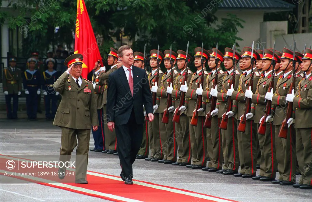 Vietnamese Defense Minister Lt. Gen. Pham Van Tra (left) escorts Secretary of Defense William S. Cohen (right) as he inspects the troops during an armed forces honors ceremony at the Ministry of Defense Guest House in Hanoi, Vietnam, on March 13, 2000. Cohen was the first U. S. defense secretary to visit Vietnam since the end of the Vietnam War in 1975.