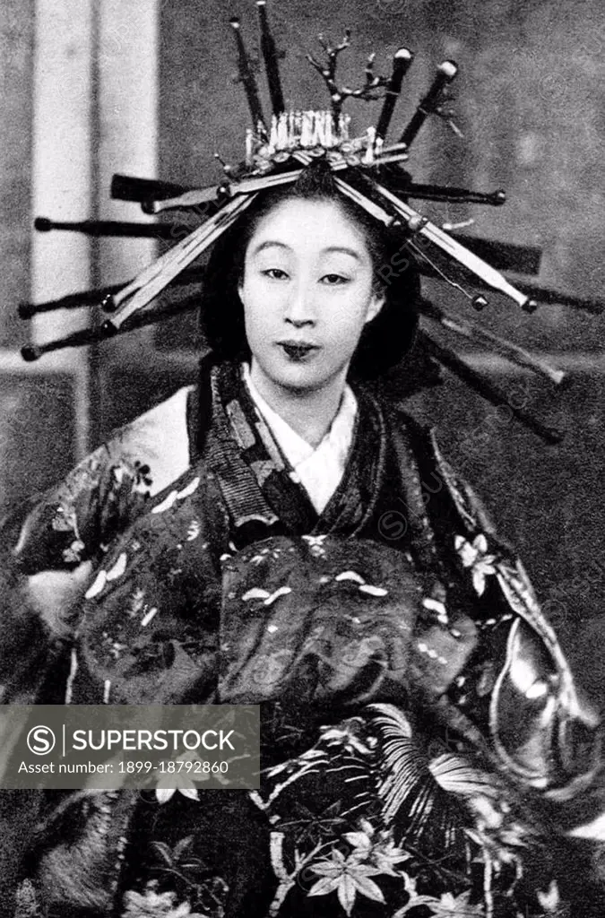 Oiran () were the courtesans of Edo period Japan. The oiran were considered a type of yujo () 'woman of pleasure' or prostitute. However, they were distinguished from the yujo in that they were entertainers, and many became celebrities of their times outside the pleasure districts. Their art and fashions often set trends among the wealthy and, because of this, cultural aspects of oiran traditions continue to be preserved to this day. The oiran arose in the Edo period (1600-1868). At this time, laws were passed restricting brothels to walled districts set some distance from the city center. In the major cities these were the Shimabara in Kyoto, the Shinmachi in Osaka, and the Yoshiwara in Edo (present-day Tokyo). These rapidly grew into large, self-contained 'pleasure quarters' offering all manner of entertainments. Within, a courtesan’s birth rank held no distinction, which was fortunate considering many of the courtesans originated as the daughters of impoverished families who wer