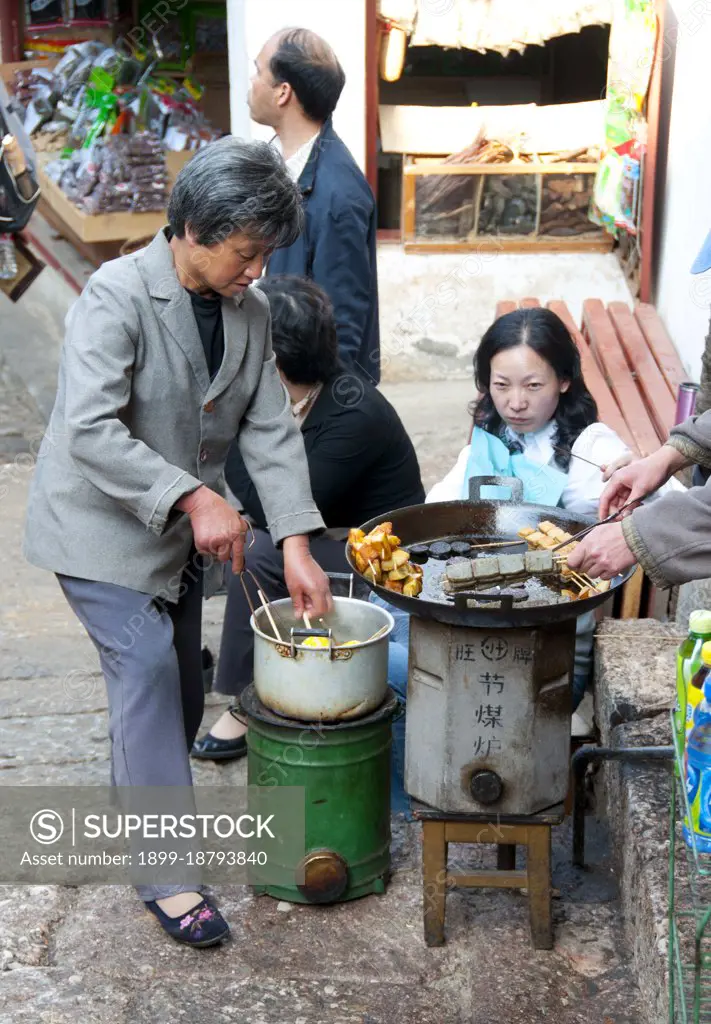 The Naxi or Nakhi are an ethnic group inhabiting the foothills of the Himalayas in the northwestern part of Yunnan Province, as well as the southwestern part of Sichuan Province in China. The Naxi are thought to have come originally from Tibet and, until recently, maintained overland trading links with Lhasa and India. The Naxi form one of the 56 ethnic groups officially recognized by the People's Republic of China. The Naxi are traditionally followers of the Dongba religion. Through both Han Chinese and Tibetan cultural influences, they adopted Tibetan Buddhism and, to a lesser extent, Taoism, in the 10th century. The Old Town of Lijiang dates back more than 800 years and was once an important town on the old Tea Horse Road.