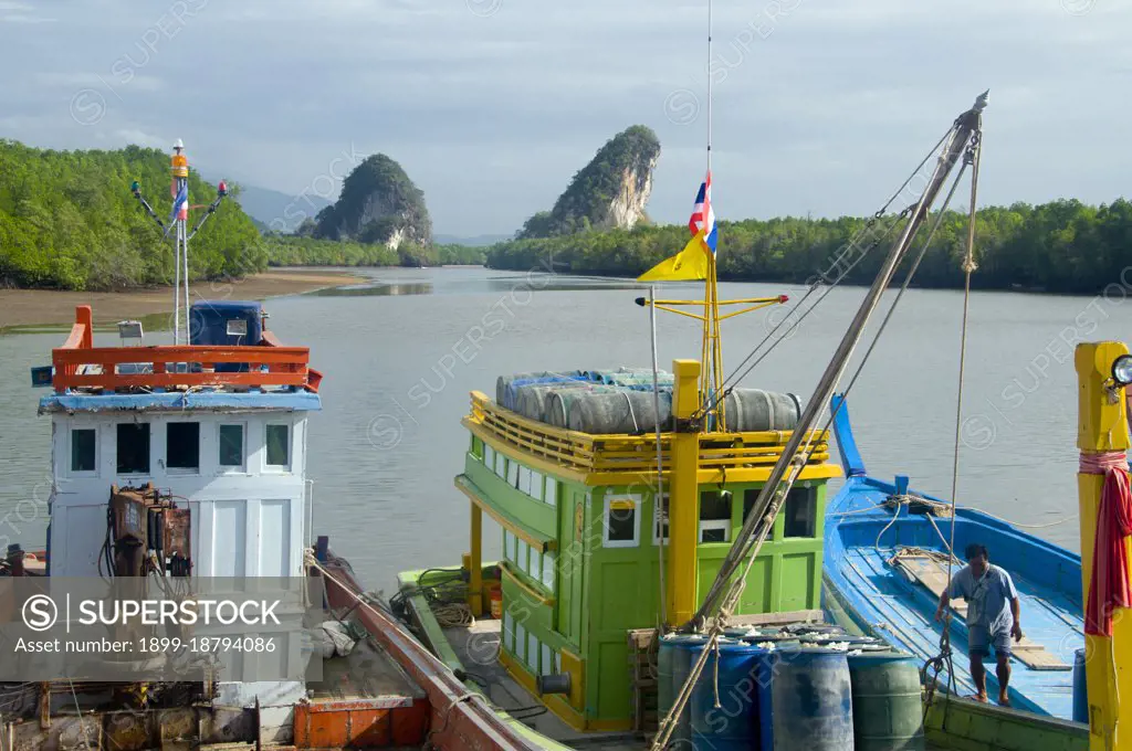 Once a simple fishing harbor, Krabi is becoming an eco-tourism center, as well as the main ferry embarkation point for islands such as Ko Lanta to the south, Ko Phi Phi to the southwest, and the beaches around Ao Nang to the west. Set on the banks of the Krabi Estuary, the town is said to take its name from a sword or krabi allegedly discovered nearby. Krabis surroundings are distinguished by towering limestone outcrops, a kind of Phang Nag Bay on land, and these have become the symbol of Krabi Province. Among the most notable are Khao Khanap Nam, twin limestone peaks, which stand like sentinels at each side of the Krabi River. To the east, the town is hemmed in by mangrove-lined shorelines.