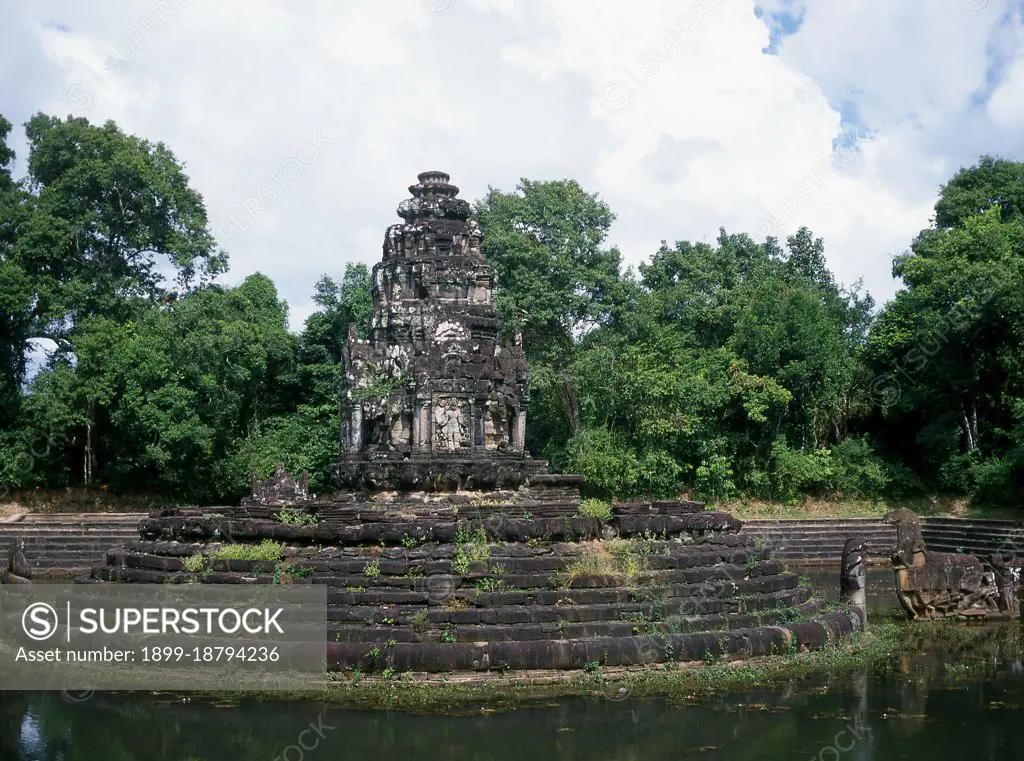 Neak Pean ('The entwined serpents') is an artificial island with a Buddhist temple on a circular island in Preah Khan Baray built during the reign of King Jayavarman VII. A baray is an artificial body of water. The central pool represents the Himalayan Lake Anavatapta, located at the summit of the universe, which was believed to give birth to the four great rivers of the world. These four rivers are represented at Neak Pean by four gargoyle-like heads which, when opened, would permit water to flow from the main pool to the four smaller pools.