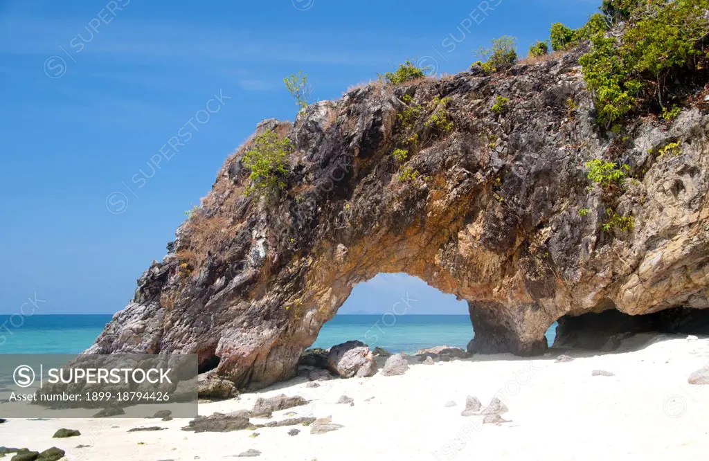 Ko Khai or Egg Island’, passed by boats en route between Ko Tarutao and Ko Adang, is favored by sea turtles for nesting. Lover's Gate on Ko Khai is a naturally carved limestone arch. Ko Tarutao Marine National Park consists of 51 islands in two main groups scattered across the Andaman Sea in southernmost Thailand. Just seven of the islands are of any size, including Ko Tarutao in the east, and Ko Adang-Ko Rawi to the west. Just 5 miles (8km) to the south lies the marine frontier with Malaysia’s celebrated Langkawi Archipelago. Tarutao is world-famous for its pristine diving sites, rich marine life and outstanding natural beauty. Covering a broad area of 575 sq miles (1490 sq km), Tarutao became Thailand’s second national marine park in 1974. Because of the location of the islands so far out to sea, the park is only safely accessible during the northeast monsoon between November and April.