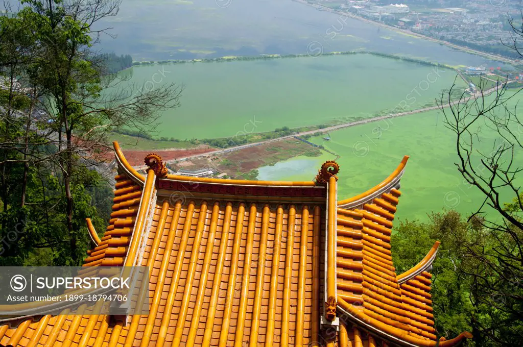 Lying 15 km west of Kunming City, the Dragon Gate (Long Men) in the Western Hills is close to the west shore of Dianchi Lake. It consists of the Sanqing Temple Complex and the Dragon Gate Grotto Complex. Dragon Gate is over 2,300 meters, 300 meters higher than the water surface of Dianchi Lake. Western Hills Forest Reserve (simplified Chinese: ; traditional Chinese: ; pinyin: Xi Shan Senlín Gongyuán) lies in the Biji Mountain chain to the west of Kunming, China. It is visible from the eastern or northern banks of Dianchi Lake.