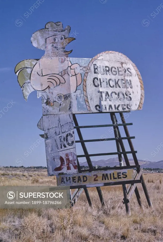 1990s America -  Chicken cowboy billboard, Elko, Nevada 1991. 