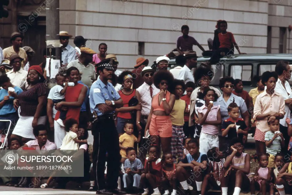 1973 - Members Of Chicago's South Side Black Community Line A Portion Of Dr. Martin L. King Jr. Drive To Watch The Annual Bud Billiken Day Parade, 08/1973. 