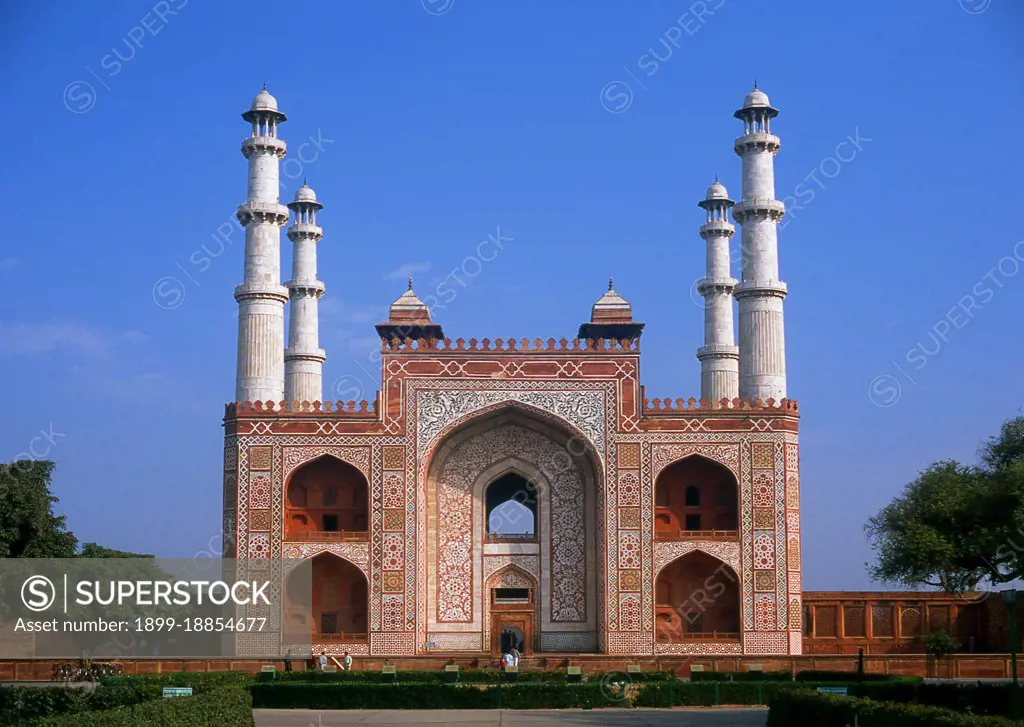 The Tomb of the the third Mughal Emperor Akbar (r. 1556-1605) is an important Mughal architectural masterpiece, built 1605-1613 and set in 48 Ha (119 acres) of grounds in Sikandra, a suburb of Agra, Uttar Pradesh, India. Emperor Akbar himself commenced its construction around 1600, according to Central Asian tradition to commence the construction of one's tomb during one's lifetime. Akbar himself planned his own tomb and selected a suitable site for it, after his death, Akbar's son Jahangir completed the construction in 1605-1613. The south gate is the largest, with four white marble chhatri-topped minarets which are similar to (and pre-date) those of the Taj Mahal, and is the normal point of entry to the tomb. The tomb itself is surrounded by a walled enclosure 105 m square. The tomb building is a four-tiered pyramid, surmounted by a marble pavilion containing the false tomb. The true tomb, as in other Mughal mausoleums, is in the basement. The buildings are constructed mainly from a 