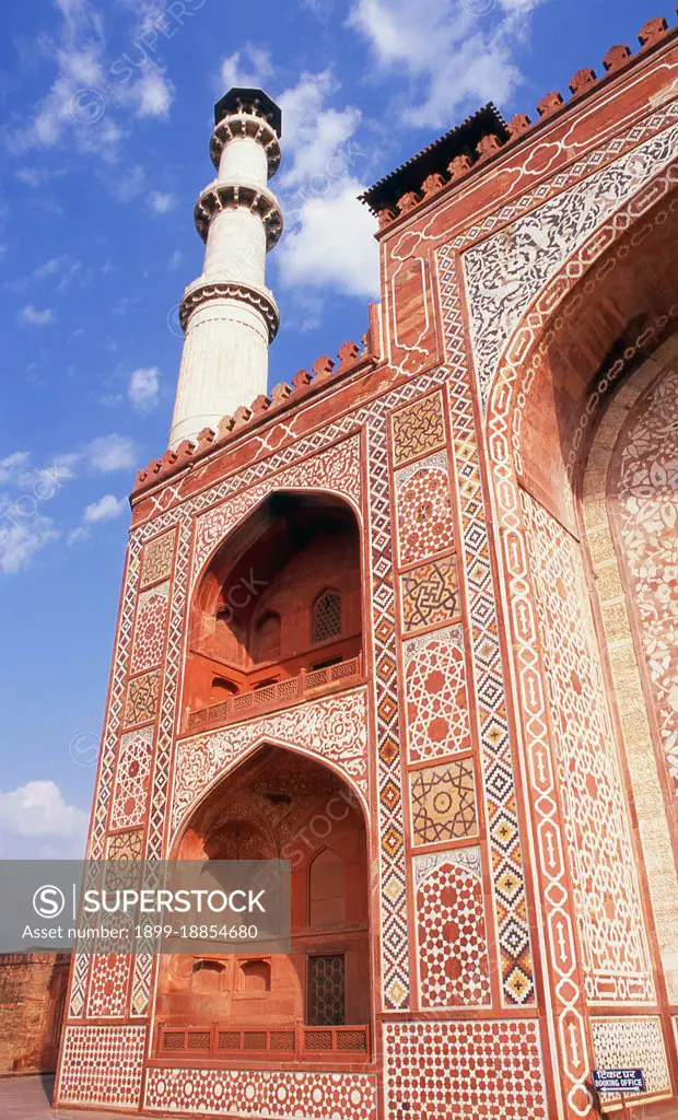 The Tomb of the the third Mughal Emperor Akbar (r. 1556-1605) is an important Mughal architectural masterpiece, built 1605-1613 and set in 48 Ha (119 acres) of grounds in Sikandra, a suburb of Agra, Uttar Pradesh, India. Emperor Akbar himself commenced its construction around 1600, according to Central Asian tradition to commence the construction of one's tomb during one's lifetime. Akbar himself planned his own tomb and selected a suitable site for it, after his death, Akbar's son Jahangir completed the construction in 1605-1613. The south gate is the largest, with four white marble chhatri-topped minarets which are similar to (and pre-date) those of the Taj Mahal, and is the normal point of entry to the tomb. The tomb itself is surrounded by a walled enclosure 105 m square. The tomb building is a four-tiered pyramid, surmounted by a marble pavilion containing the false tomb. The true tomb, as in other Mughal mausoleums, is in the basement. The buildings are constructed mainly from a 