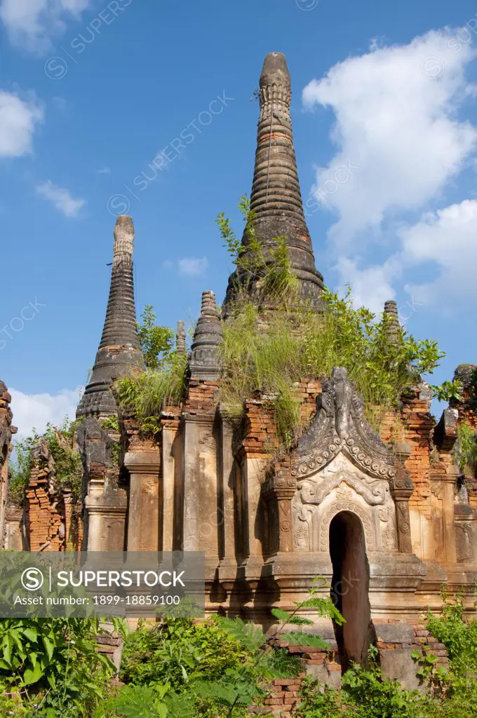 Nyaung Ohak and the Shwe Indein Pagoda are collections of Buddhist stupas dating back to the 17th and 18th centuries CE. Inle Lake is a freshwater lake located in the Nyaungshwe Township of Taunggyi District of Shan State, part of Shan Hills in Myanmar (Burma). It is the second largest lake in Myanmar with an estimated surface area of 44.9 square miles (116 km2), and one of the highest at an altitude of 2,900 feet (880 m). The people of Inle Lake (called Intha), some 70,000 of them, live in four cities bordering the lake, in numerous small villages along the lake's shores, and on the lake itself. The entire lake area is in Nyaung Shwe township. The population consists predominantly of Intha, with a mix of other Shan, Taungyo, Pa-O (Taungthu), Danu, Kayah, Danaw and Bamar ethnicities. Most are devout Buddhists, and live in simple houses of wood and woven bamboo on stilts; they are largely self-sufficient farmers. Most transportation on the lake is traditionally by small boats, or by som