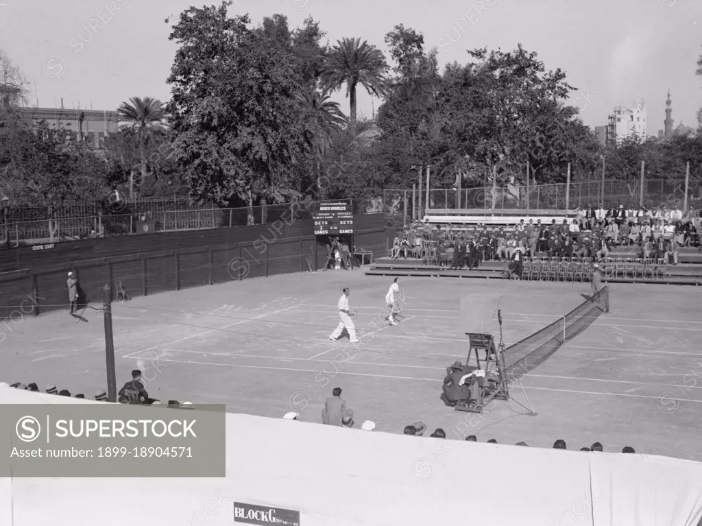 Gezira Gardens & Sports Club in Cairo Egypt, men playing on the tennis courts ca. between 1934 and 1939.