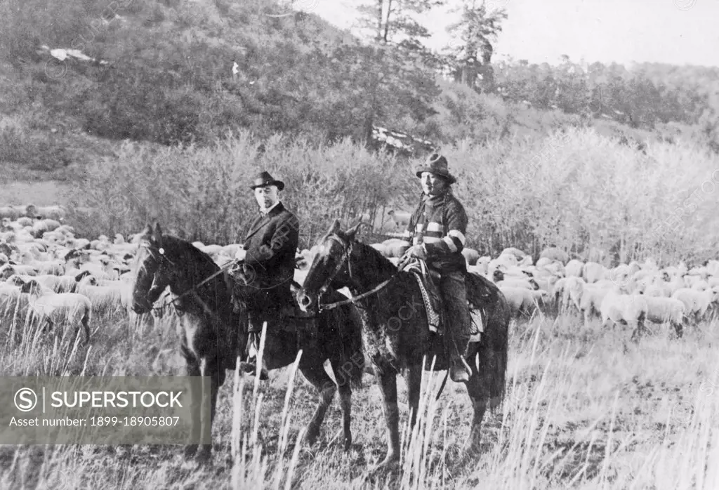 Edd Ladd, full-blood Apache Indian, of the Jicarilla Reservation, New Mexico, with Indian Commissioner Cato Sells, on horseback ca. 1909.