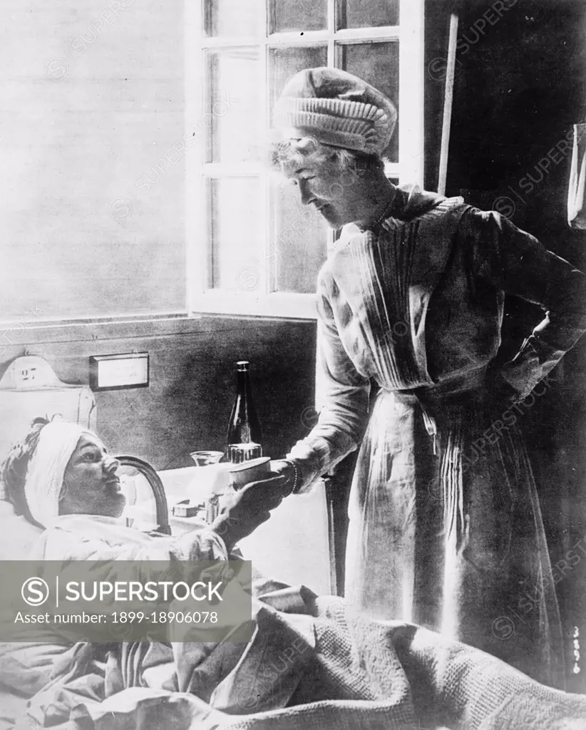 Nurse and patient ca.  between 1910 and 1935.