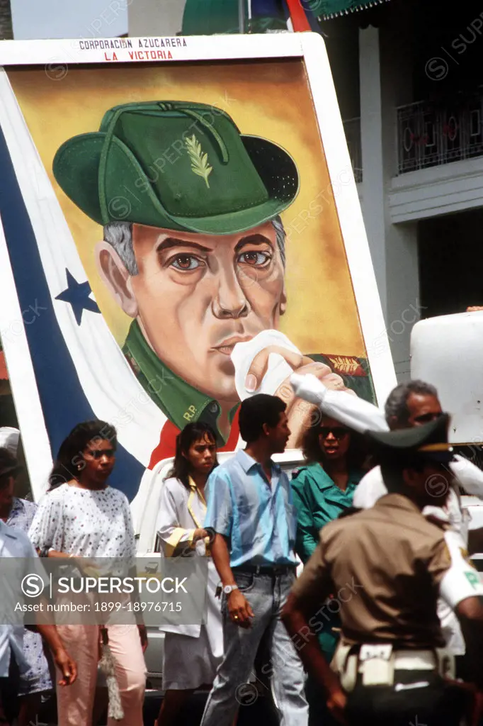 Panamanian civilians carry a portrait of former President Omar Torrijos through the streets outside the gate of Fort Amador, headquarters of the US Southern Command. 